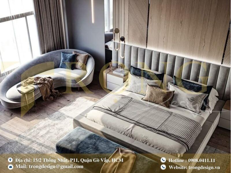 Phòng ngủ tinh tế với ghế sofa cong độc đáo và gam màu dịu nhẹ.