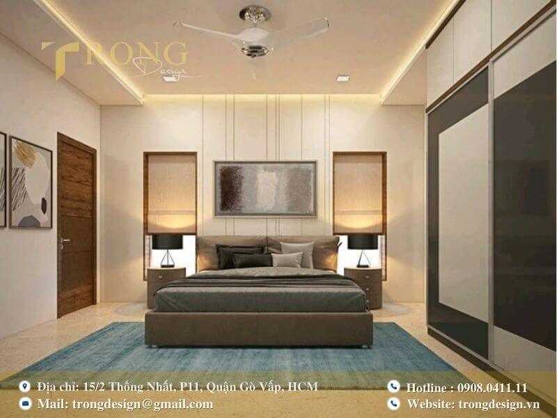 Phòng ngủ tối giản, hiện đại với tông màu trung tính và điểm nhấn xanh lam.