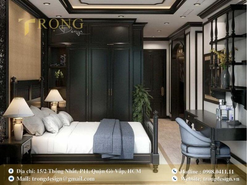 Phòng ngủ Indochine với nội thất đen sang trọng và họa tiết truyền thống.