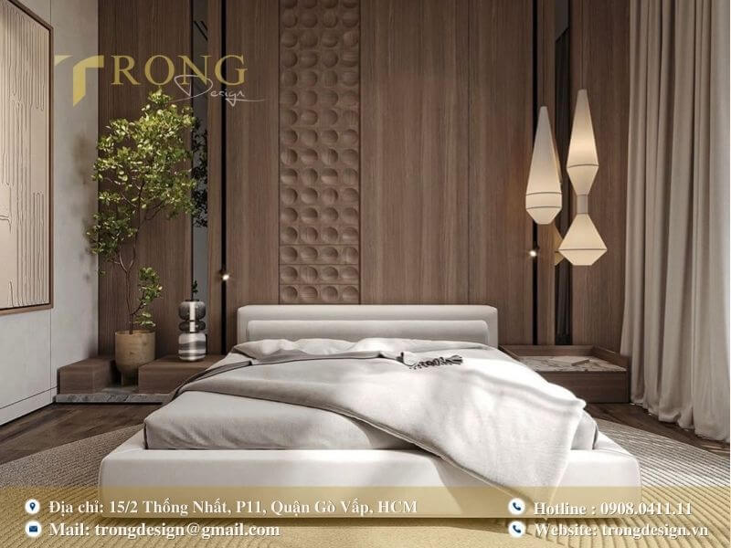 Không gian phòng ngủ sang trọng với mảng tường ốp vải cong mềm mại.