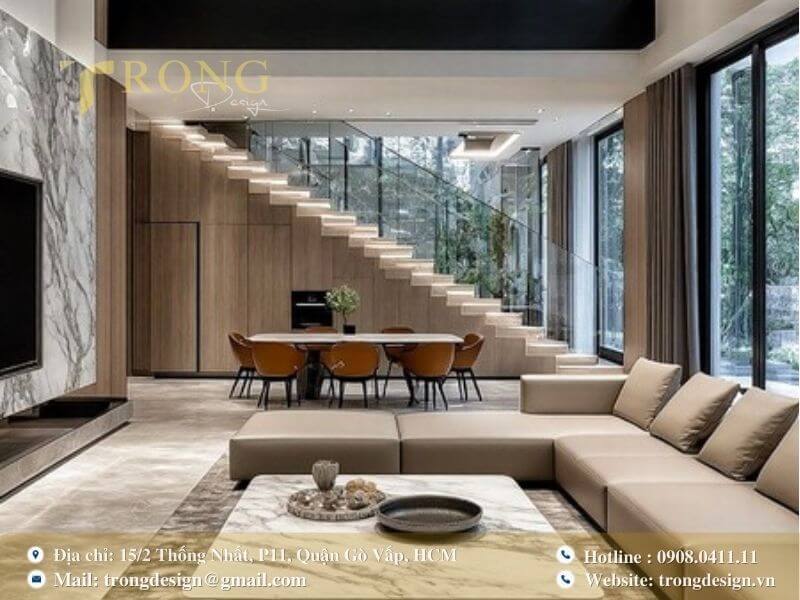 Phòng khách hiện đại, sử dụng vật liệu cao cấp và cầu thang thiết kế ấn tượng.