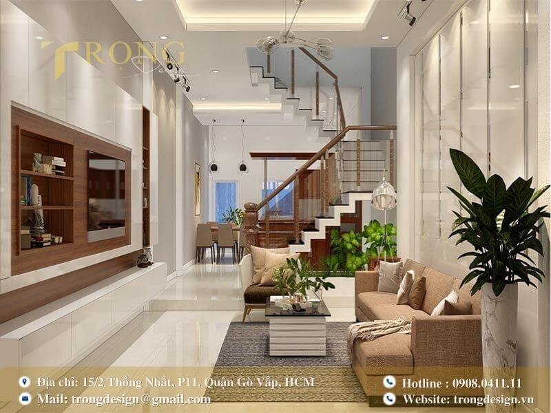 Phòng khách hiện đại, gọn gàng với nội thất tông màu trắng và gỗ.